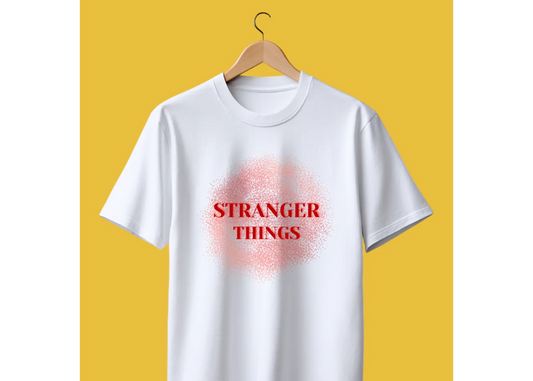 White oversized t-shirt with red Stranger Things print on front, displayed on hanger