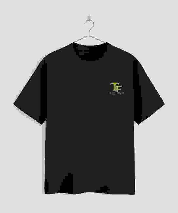 Black t-shirt with a Trend Fever logo on a hanger against a light gray background