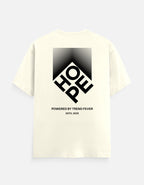 An off-white short-sleeve t-shirt with a large black graphic on the back. The graphic features a diamond shape containing the letters 'HOE' and 'FP' in a stylized layout, with the text 'POWERED BY TREND FEVER' and 'ESTD.