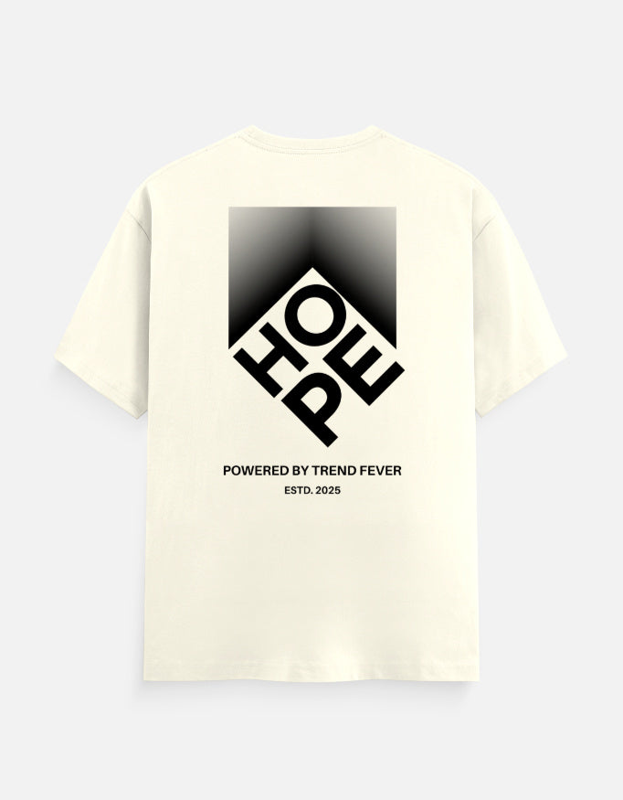 An off-white short-sleeve t-shirt with a large black graphic on the back. The graphic features a diamond shape containing the letters 'HOE' and 'FP' in a stylized layout, with the text 'POWERED BY TREND FEVER' and 'ESTD.