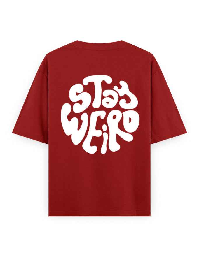Oversized red streetwear t-shirt with bold white 'Stay Weird' graphic on back