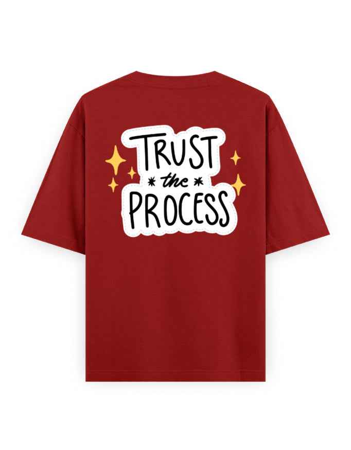 Oversized red t-shirt with 'Trust the Process' slogan and graphic design on the back