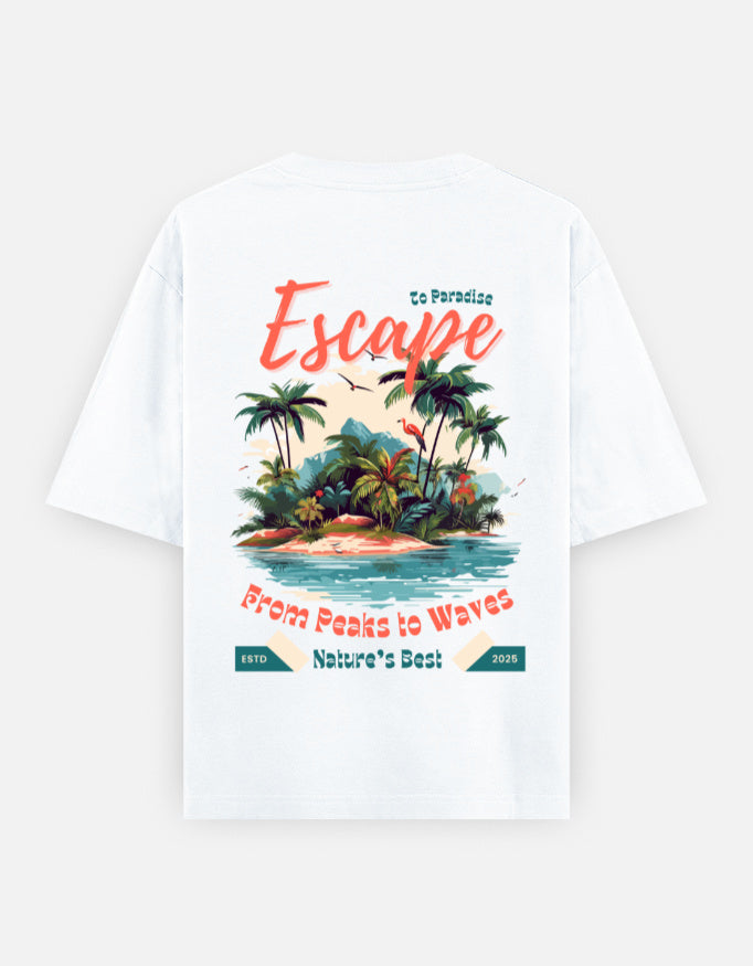 White short-sleeve T-shirt shown flat against a light gray background, featuring a large tropical beach graphic on the front with palm trees, a small island, and coral text reading 'Escape' and 'From Peaks to Waves' plus 'Nature's Best'.