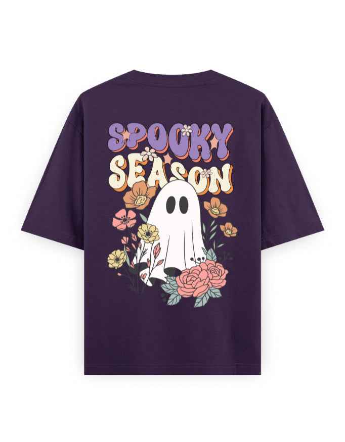 Purple oversized t-shirt with 'Spooky Season' text, ghost and floral graphic on the back.
