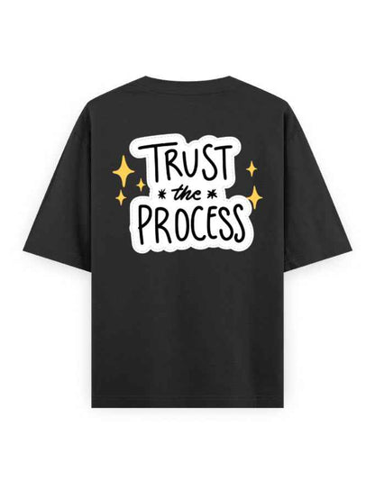 Black oversized t-shirt with 'Trust the Process' graphic and yellow stars on the back