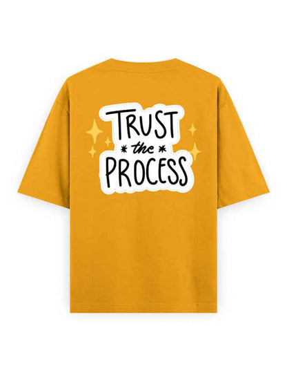Oversized mustard yellow t-shirt with 'Trust the Process' graphic on the back, streetwear style