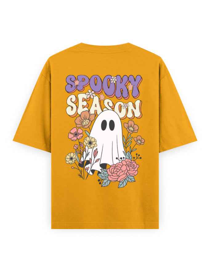 Mustard yellow oversized t-shirt with 'Spooky Season' text, ghost graphic, and floral design on back