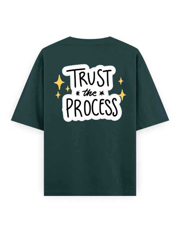 Oversized dark green streetwear t-shirt with 'Trust the Process' bold graphic on back