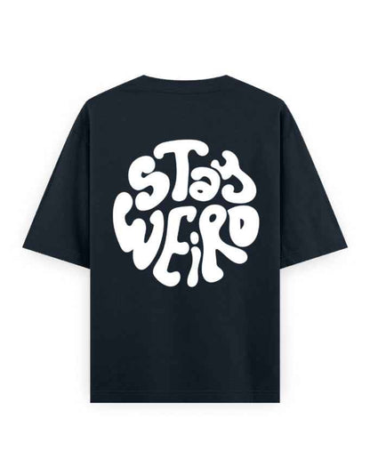 Black oversized streetwear t-shirt with bold white 'Stay Weird' graphic on back