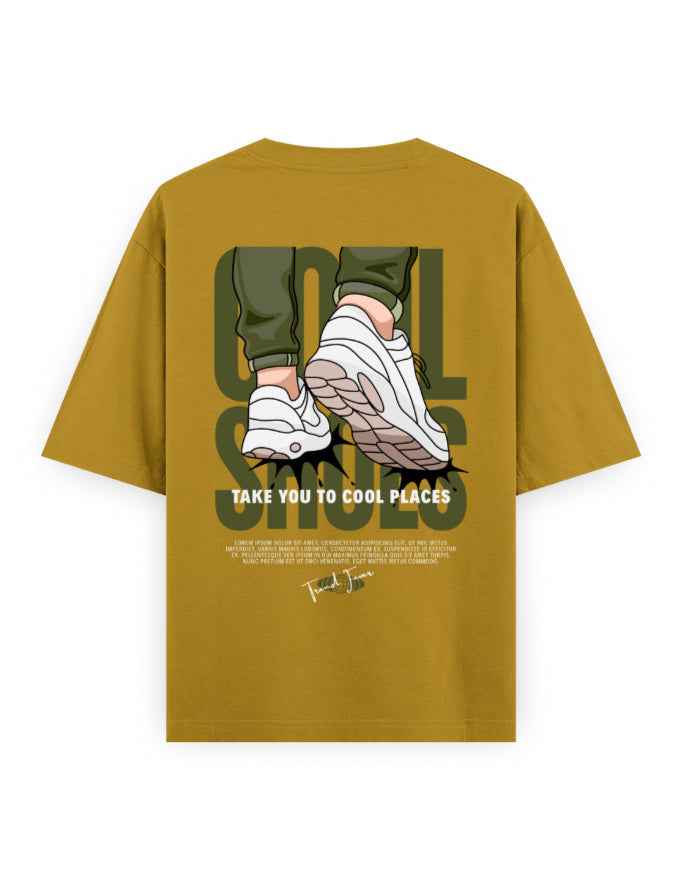 Oversized mustard streetwear t-shirt with sneaker graphic and 'take you to cool places' text