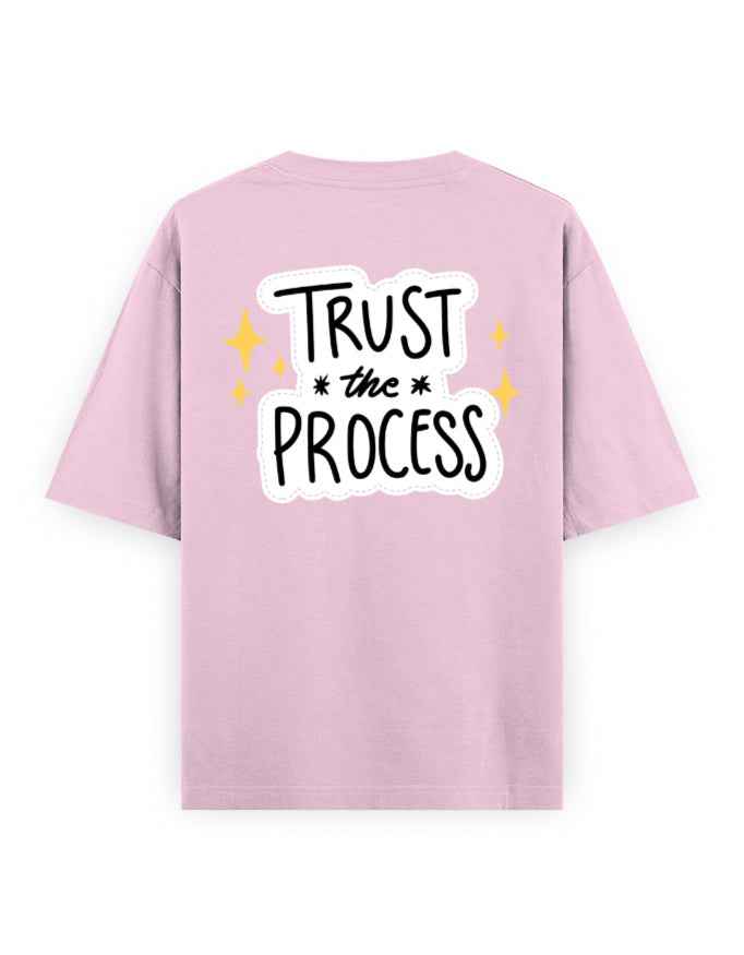 Pink oversized streetwear t-shirt with 'Trust the Process' graphic on the back