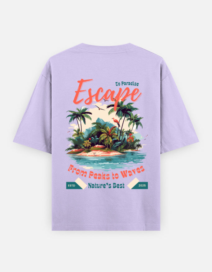 A light purple short-sleeve t-shirt shown from the back, featuring a colorful graphic print of a tropical island with palm trees and text that reads 'Escape' and 'From Peaks to Waves'.