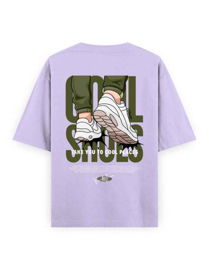 Oversized lavender t-shirt with cartoon sneakers graphic and bold text on the back