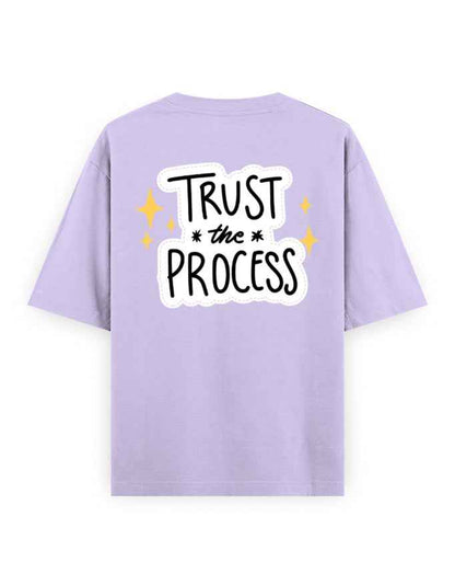 Lavender oversized t-shirt with 'Trust the Process' graphic and yellow stars on the back