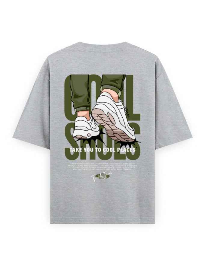 Grey oversized streetwear t-shirt with graphic print of sneakers and bold text on the back