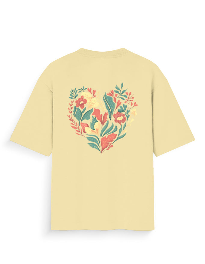 Oversized beige t-shirt with colorful floral heart graphic on the back