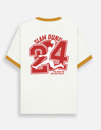 An off-white short-sleeve Trend Fever t-shirt with gold trim on the collar and cuffs, featuring a large red graphic on the back with the text 'SLAM DUNK', a large number '24', and a basketball player silhouette.