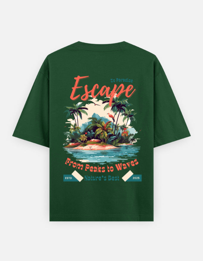 A dark green short-sleeve t-shirt with a large tropical beach graphic on the back. The graphic features the word 'Escape' in coral script, a tropical island scene with palm trees and a sunset, and the text 'From Peaks to Waves' and 'Nature's Best'.