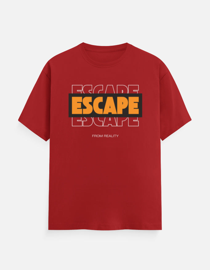 A red short-sleeve crewneck t-shirt with a graphic on the chest featuring the word 'ESCAPE' in yellow and black, layered over a faded white outline of the same word, with 'FROM REALITY' printed below in small white letters.