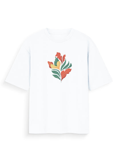 White oversized t-shirt with abstract botanical print in orange, green, and yellow.