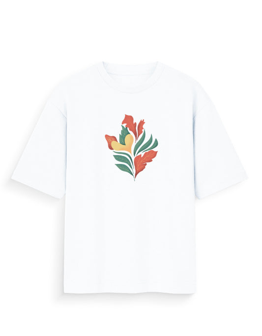 White oversized t-shirt with abstract botanical print in orange, green, and yellow.