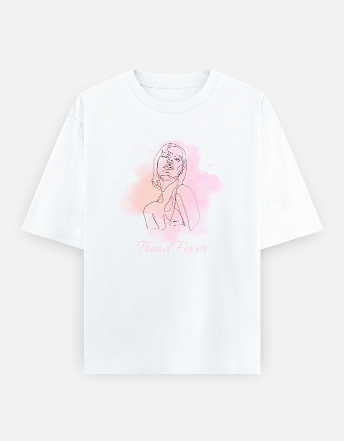 A white short-sleeve crewneck t-shirt featuring a minimalist line art illustration of a woman with a pink watercolor splash and the text 'Trend Fever' printed below, displayed on a light gray background.