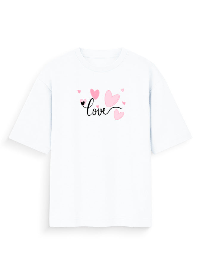 White oversized t-shirt with 'love' text and pink heart graphic, streetwear fashion.