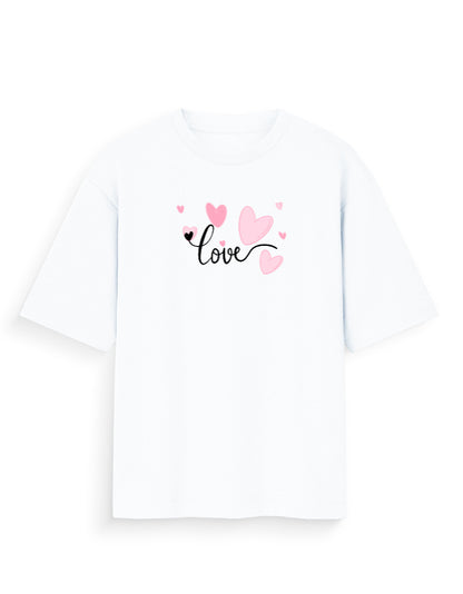 White oversized t-shirt with 'love' text and pink heart graphic, streetwear fashion.