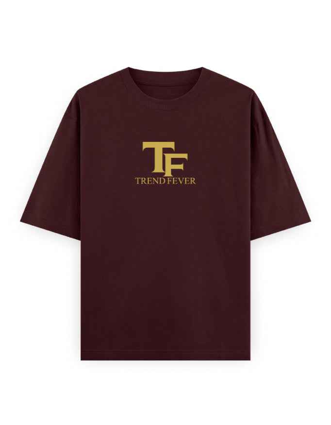 Maroon oversized t-shirt with bold yellow TF Trend Fever logo on front