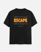 A TREND FEVER black short-sleeve t-shirt with a graphic print on the chest reading 'ESCAPE ESCAPE ESCAPE' in orange and white, with 'FROM REALITY' printed below it, displayed against a light gray background.