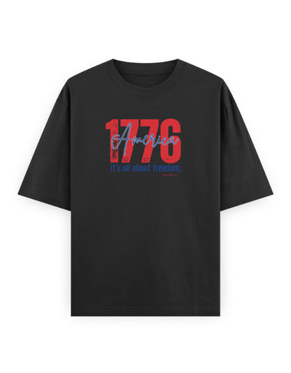 Black oversized streetwear t-shirt with red '1776' and blue 'America' freedom graphic print.