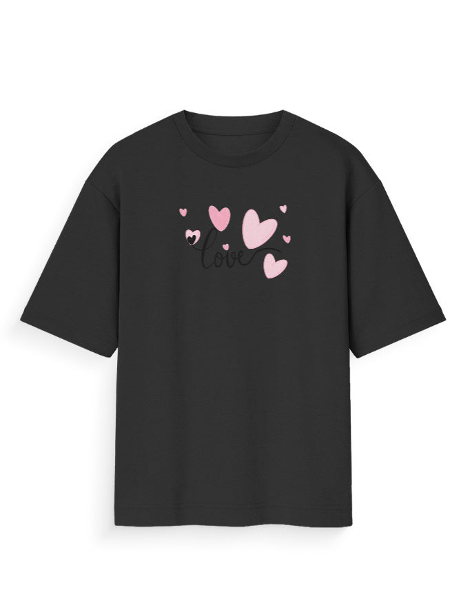 Black oversized t-shirt with pink heart graphics and 'love' text, streetwear fashion