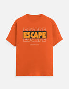 A TREND FEVER orange short-sleeve crewneck t-shirt with a graphic on the chest reading 'ESCAPE' in yellow and black, with 'FROM REALITY' printed below, displayed on a light gray background.