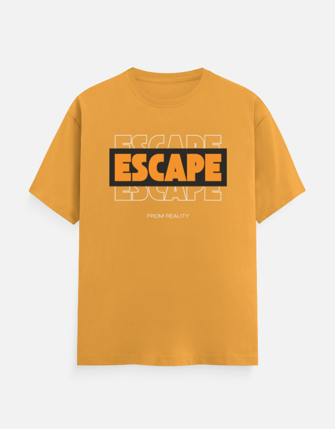 A mustard yellow short-sleeve t-shirt with a graphic on the chest reading 'ESCAPE' in orange and black, with 'FROM REALITY' printed below, displayed on a light gray background.