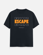 A black short-sleeve t-shirt with a graphic on the chest reading 'ESCAPE ESCAPE ESCAPE' in orange and white, with 'FROM REALITY' printed below, shown against a light gray background.