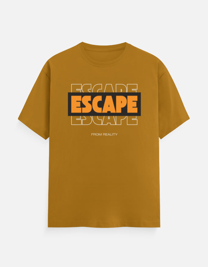 A mustard yellow short-sleeve t-shirt with a graphic on the chest reading 'ESCAPE' in orange and black, with 'FROM REALITY' printed below, displayed on a light gray background.