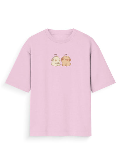 Light pink oversized T-shirt with cute cartoon dog graphic and 'you me' text on chest