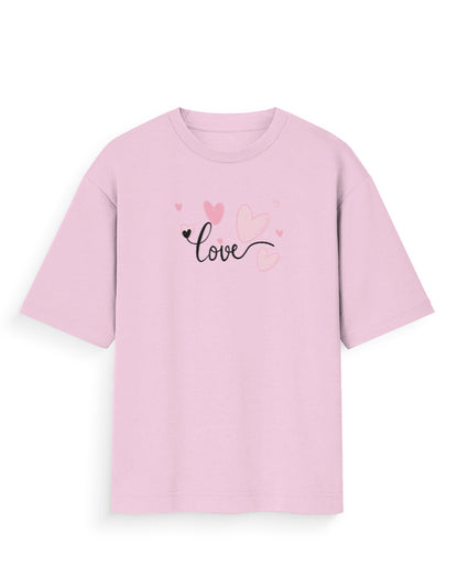 Oversized pink t-shirt with 'love' script and heart graphics, streetwear fashion.