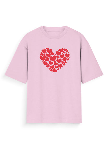Light pink oversized t-shirt with red heart pattern graphic, streetwear style