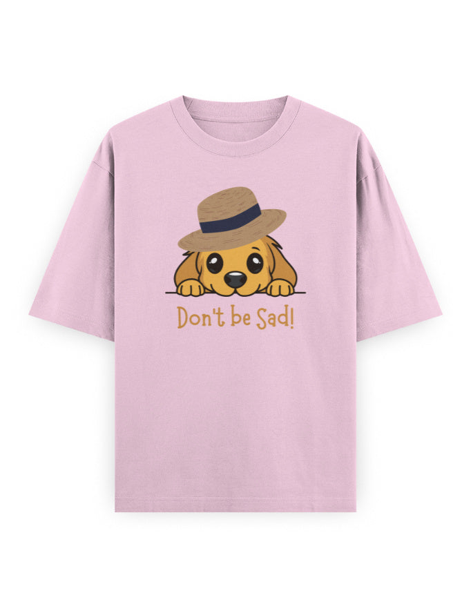 Pink oversized t-shirt with cartoon dog in a hat and 'Don't be Sad!' text, streetwear style