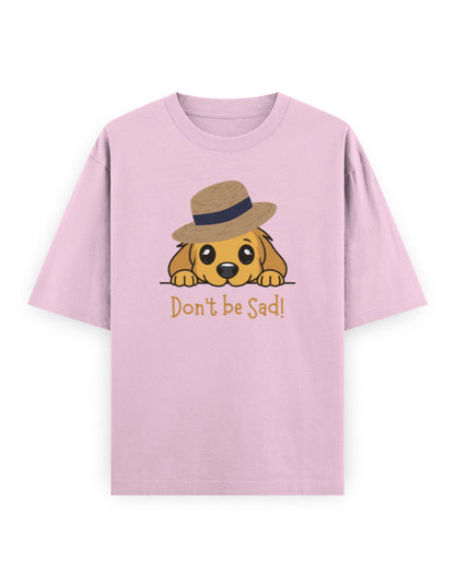 Pink oversized t-shirt with cartoon dog in a hat and 'Don't be Sad!' text, streetwear style