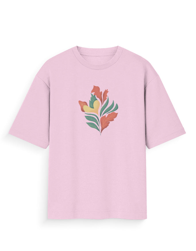 Light pink oversized t-shirt with colorful abstract leaf print on front