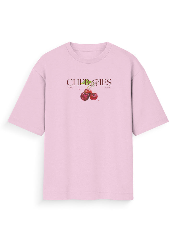 Light pink oversized t-shirt with cherries graphic and bold streetwear print on front.