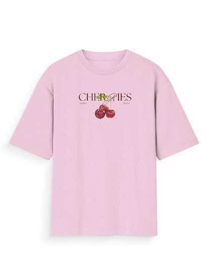 Light pink oversized t-shirt with cherries graphic and bold streetwear print on front.