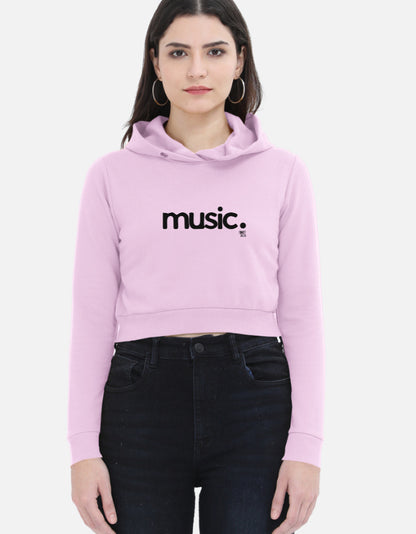 Woman wearing light purple cropped hoodie with 'music.' text, streetwear fashion