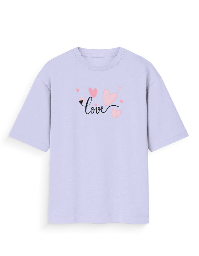 Oversized pastel purple t-shirt with 'love' text and pink heart graphics on front