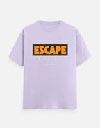 A light purple short-sleeve t-shirt with a graphic on the chest. The graphic features the word 'ESCAPE' in bold orange letters inside a black rectangular box, with a faint white 'ESCAPE' text design layered behind it, and 'FUCK REALITY' printed in small white text below.