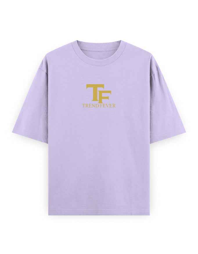 Light purple oversized t-shirt with gold TF Trend Fever logo on front, streetwear fashion