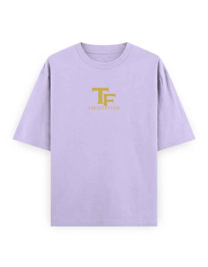Lilac oversized t-shirt with gold TF logo and bold streetwear style print on front