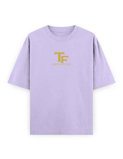 Lilac oversized t-shirt with gold TF logo and bold streetwear style print on front